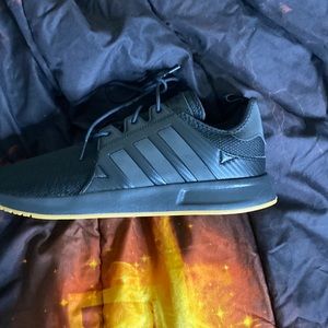 Black adidas athletic shoes